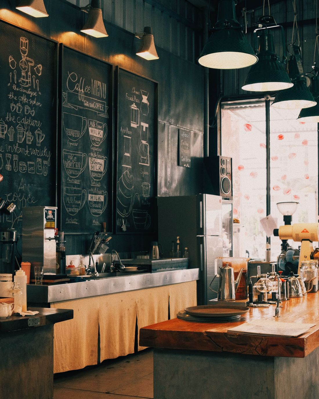 A warmly lit independent cafe with a timber coffee bar