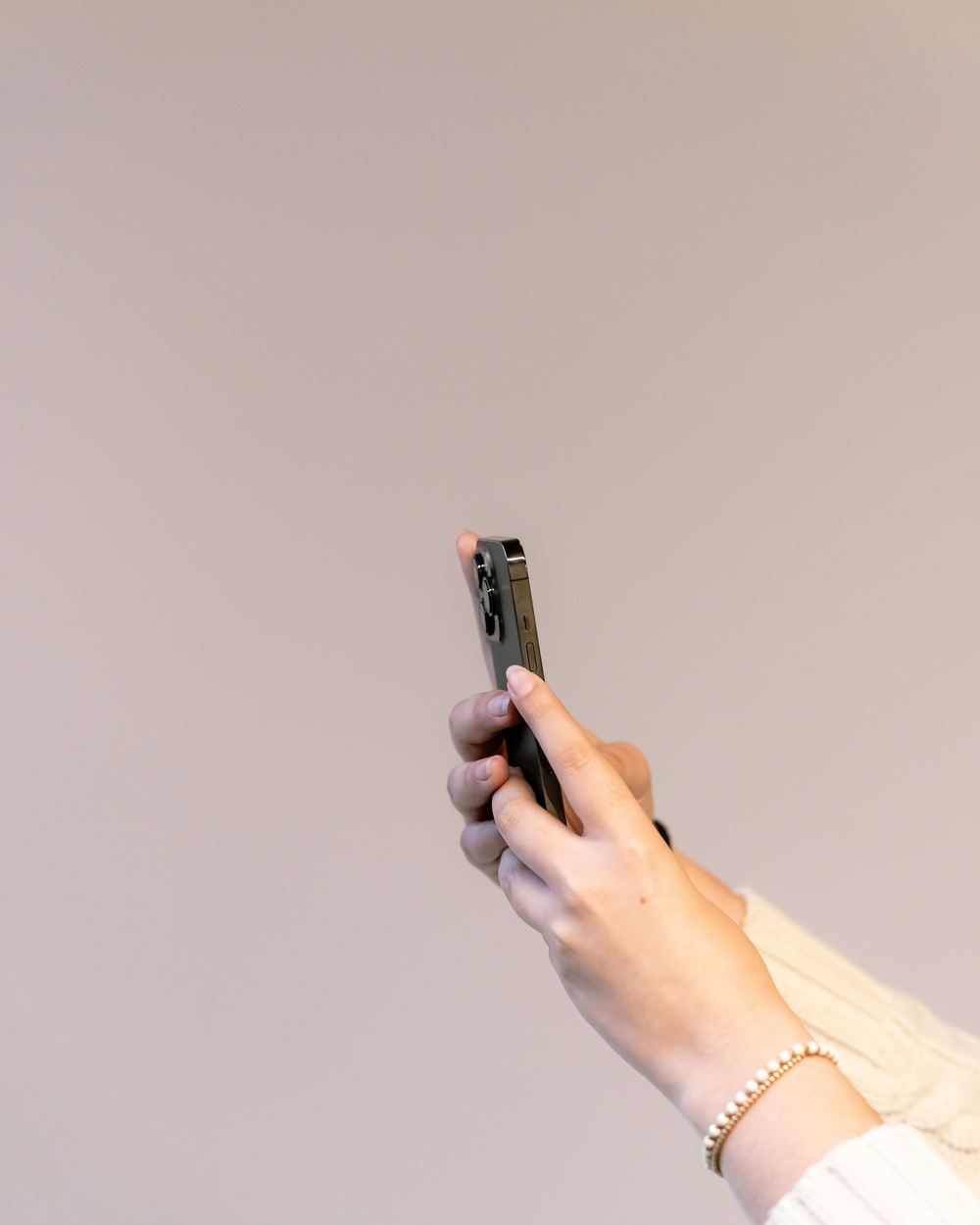 Close-up of a hand using a phone